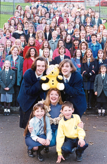 A crowd of children along with Fiona Kennedy fundraising for Children In Need