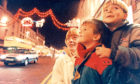 1990: Liz Grant and her sons Malcolm, 4, and Andrew, 6, admire the Christmas lights