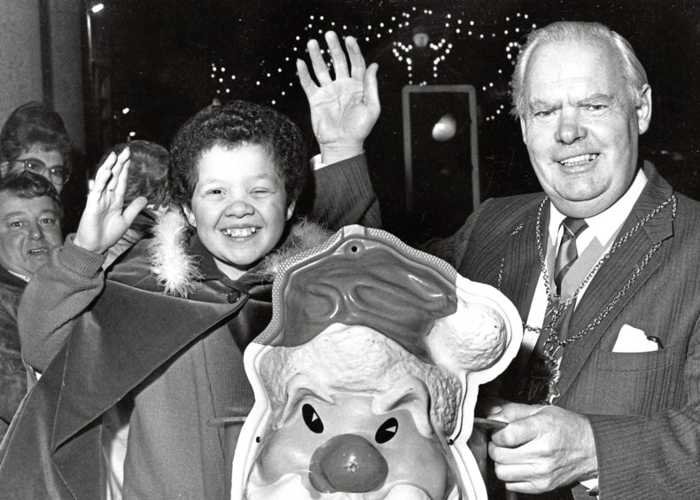 1986: Lord Provost Henry Rae and Susan Henderson after she officially switched on the Christmas lights