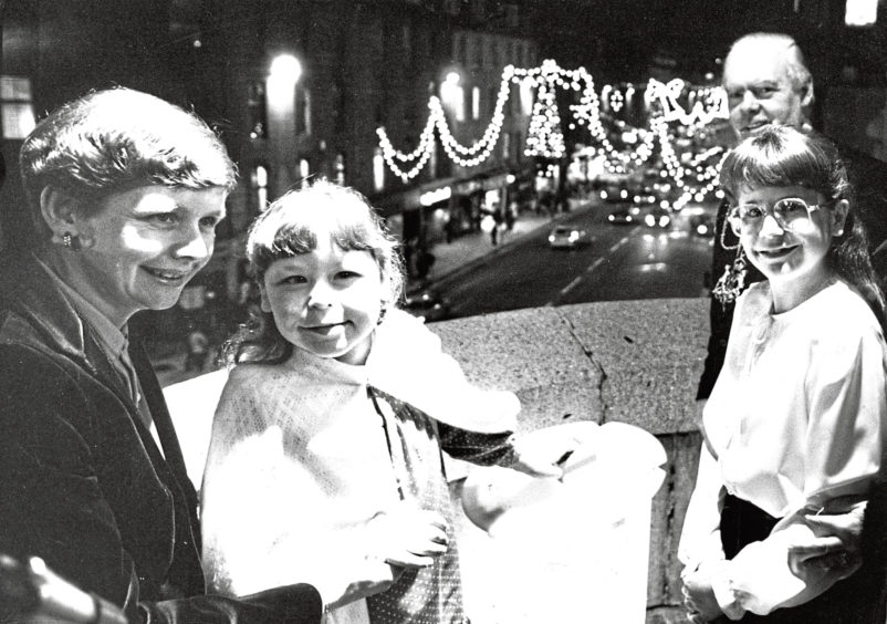 1984: A proud moment for Jill Hird as she presses the button to switch on the Christmas lights in Aberdeen – from left, Jill’s mother Linda, Jill’s sister Alison, 11, and Lord Provost Henry Rae