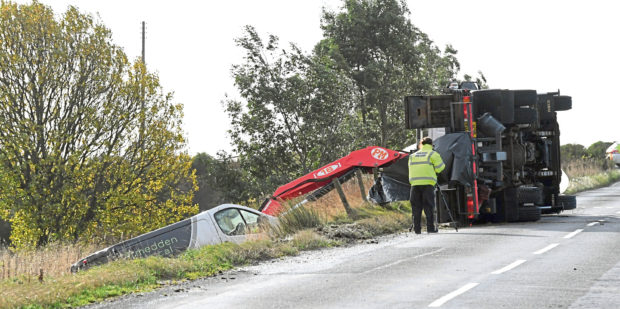 The crashed van and overturned recovery vehicle on the B999