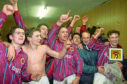 The Stenhousemuir players celebrate in the dressing room after knocking Aberdeen out of the Scottish Cup in 1995.