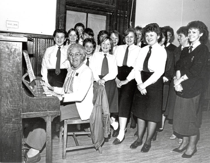 1987: Torry Church 24th Girls’ Brigade rehearsing with pianist Bess Watkins for the divisional choir competitions