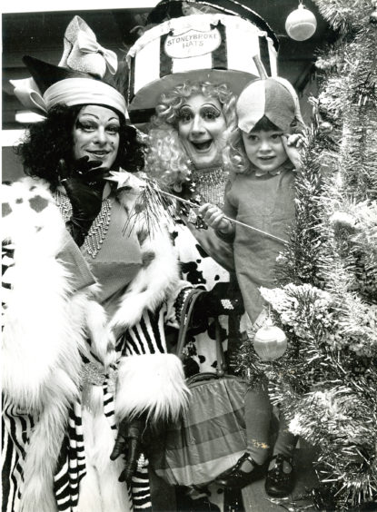 1987: Three-year-old Amy Donaldson caught the eye of Nigel Ellacot, left, and Peter Robbins from the cast of HMT’s Cinderella at a fancy dress party