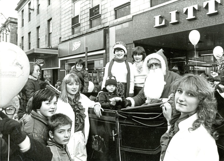 1982: Santa turned out at Littlewoods store with a small present for four-year-old Jason Bruce. Also in the picture are ice-maidens Niki Esson, left, and Lindsay Hood and (in carriage) pixies Gillian Emslie and Jennifer Cormack