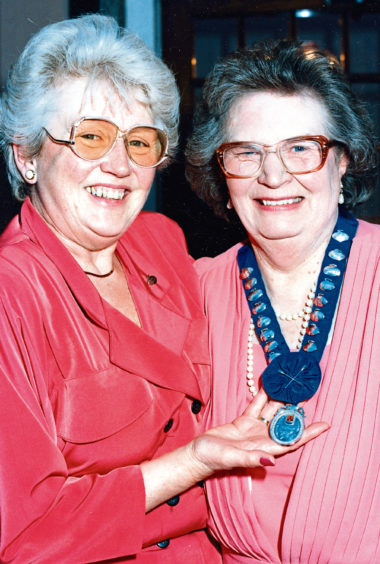 1991 : Elma Martin, past president of the Aberdeen Ladies Curling Club, left, hands over to the new president, Annabel Hogg at their annual dinner and prizegiving at the Palm Court