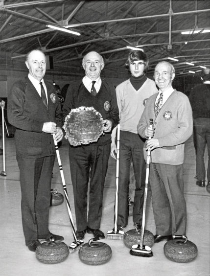 1975: Skip Jack Suttie proudly displays the Westburn Salver which his team, Aberdeen, won in the Scottish Grocers’ Federation curling championship at Falkirk. Other members of the team are, from left, Hugh Thom, David Suttie and Duncan McGregor