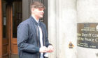 Cameron Reyboz leaves Aberdeen Sheriff Court after he admitted driving at up to 80mph in a 30mph area