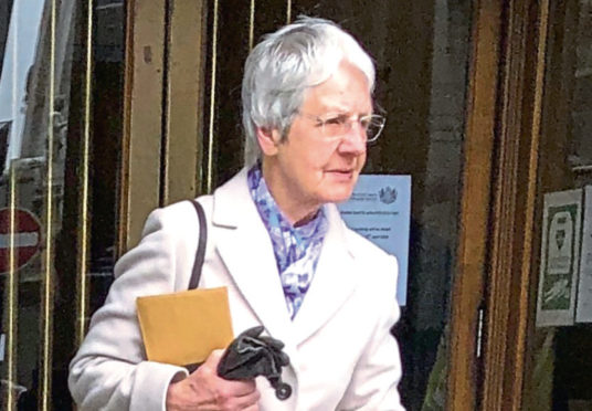 Stella Masson, 82, leaving Aberdeen Sheriff Court after being fined for playing loud music and banging on walls