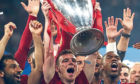 Andy Robertson of Liverpool lifts the Champions League trophy.