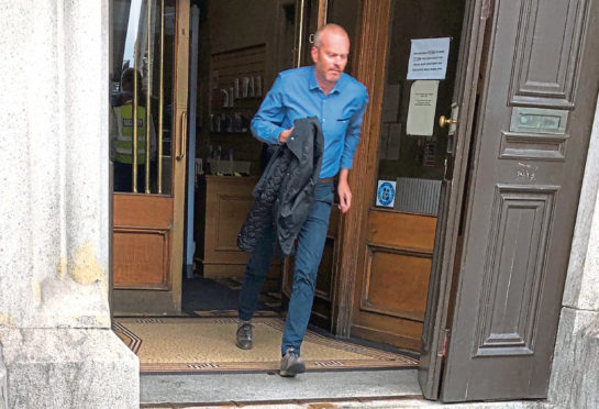 Gavin Pirie running out of Aberdeen Sheriff Court