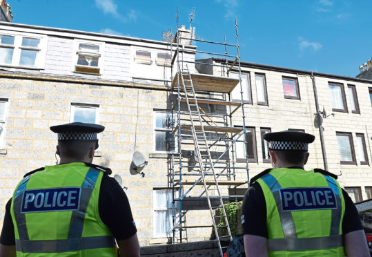 Police at the scene after Joseph Kane, 56, died as a result of a fall from a ladder on scaffolding in 2016