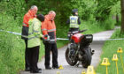 Police at the scene where Christopher Christie crashed his motorbike on the old railway line at Cults