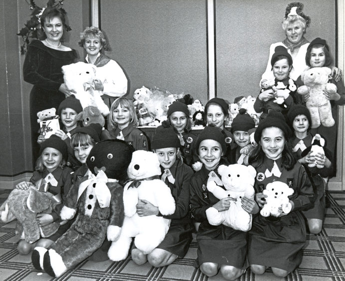 A Christmas appeal gifts soft toys with help from the 39th Queens Cross Brownies