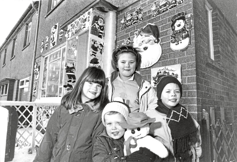 1990: Grandchildren of Ina Smith outside her Santa-covered house at Fernielea Crescent, Aberdeen