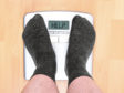 overweight man on personal scales; Shutterstock ID 206253880; Purchase Order: -