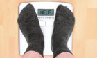 overweight man on personal scales; Shutterstock ID 206253880; Purchase Order: -