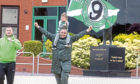 Celtic fans celebrate being awarded the Premiership title outside Parkhead yesterday.