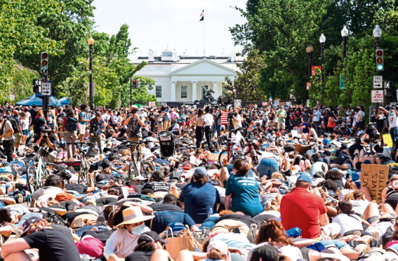 Anti-racism protesters in Washington DC gather outside the White House