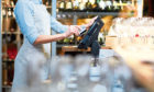 Close-up of waitress registrating orders at the cash desk; Shutterstock ID 1038204025; Purchase Order: -