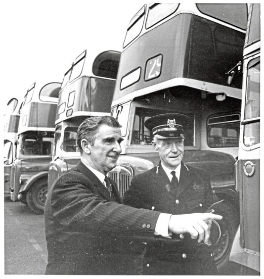 1973: Works supervisor Mr Jim Anderson (left) keeps the garage inspector, Mr George Adam, up-to-date on the latest buses made ready for the road by his men.