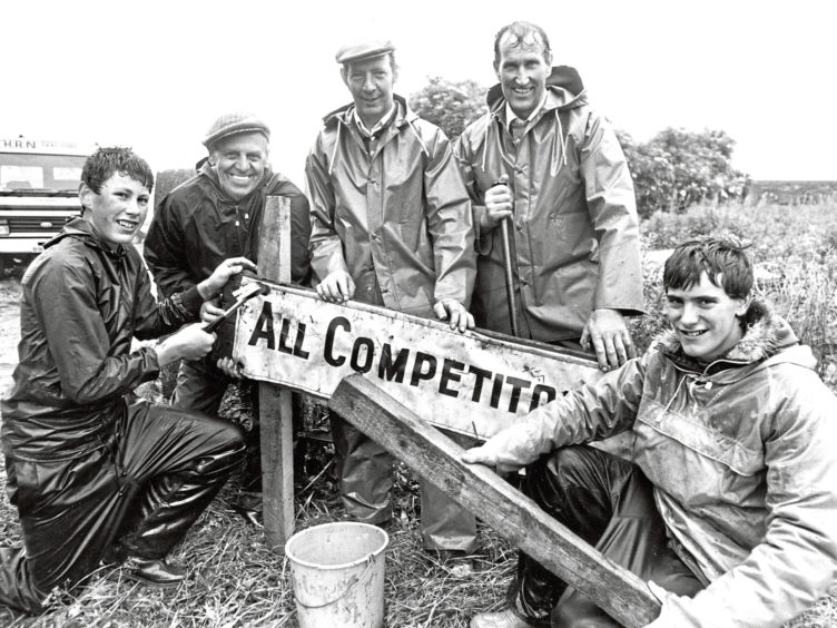 1987: Smiling while they work despite the weather as they set up the show are (from left): Graeme Swanson, Clockhill, Maud; Robbie Lawrie, Belvidere, New Deer, show vice-president; Ian Glennie, Knapps, New Deer; John Swanson, Clockhill, Maud, junior vice-president; and Stewart Bell, Drum Croft, Maud.