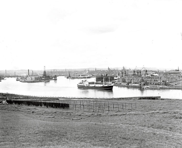 1960 :A ship leaving Aberdeen Harbour taken from Balnagask Golf Course.