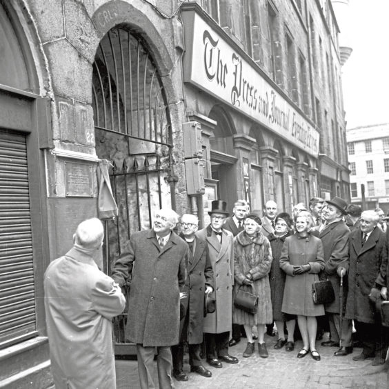 1968: Dr John Betjeman, CBE, poet and TV personality unveiled a plaque to mark the birthplace of Alexander Cruden (compiler of the renowned Biblical Concordance) outside the the entrance to the offices of Aberdeen Journals in Broad Street in February 1968. On the left is Lord Provost Robert S  Lennox. When the buildings in Broad Street were demolished the plaque was repositioned at the top of a small flight of stairs behind the Town House, off Concert Court.
