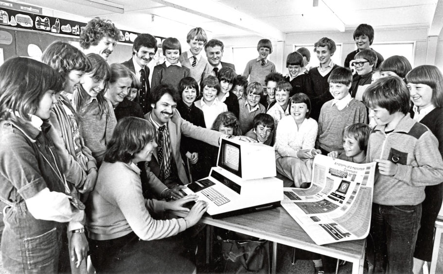1981: Heather Morrison at the keyboard of the new computer watched by Primary 7 pupils, Jim Cummings, science teacher Clive Marsden and headmaster Raymond Bisset