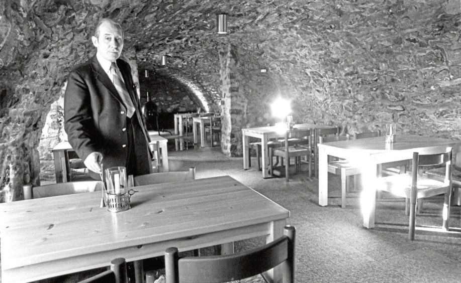 1975: Custodian George Smith in Provost Skene's Kitchen, converted from two storage cellars.