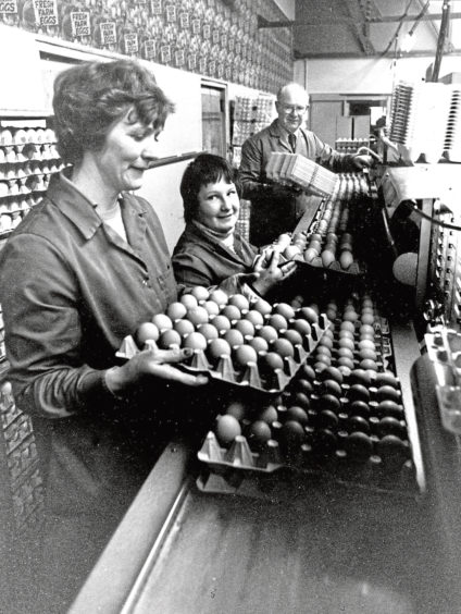 1982: Packer Lillian Shand, left, holds a tray of ungraded eggs, watched by Nicola Greening and station foreman Harry Rennie at the Huntly headquarters of Banffshire Egg Packers.