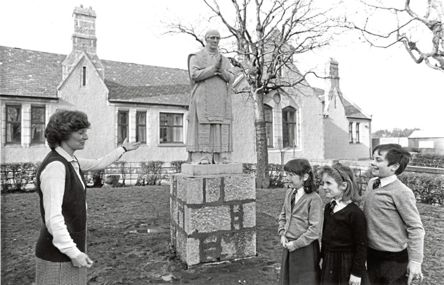 1983: Headmistress Mrs Joan Fenton shows pupils of St Peters School (left to right) Laura McMillan (8), Claire Babington (6) and Anthony Mutch (10) the statue of the founder of the Aberdeen school, which has been re-erected at the school's new site at King Street,