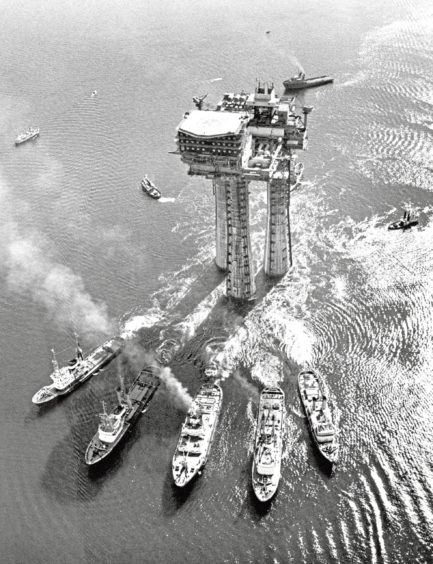 1975: An oil platform is transported from Stavanger, Norway to the Brent oil and gas field in the North Sea.