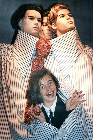 1992:  Suzanne Mireylees tries on the world's biggest shirt in an E&M's promotion.