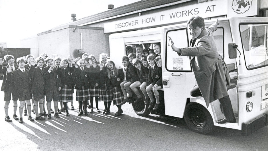 1992: Welcoming Mr Michael Faraday, the 19th century inventor, as he arrives in his electric milk float at Aberdeen's Satrosphere are pupils from Robert Gordon's College.