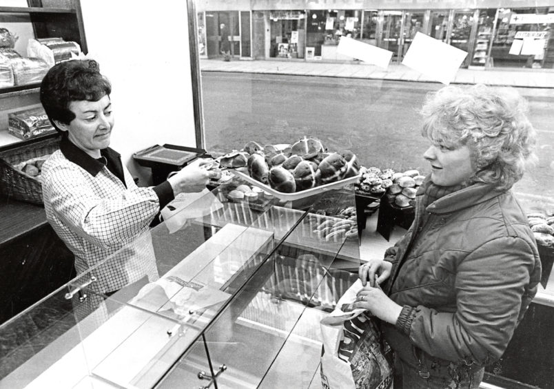 1986: Assistant Mrs Liz Tyrie serves customer Mrs Lucy Gerrie at the about-to-close 123 George Street premises of Aberdeen bakers A. B. Hutchison.
