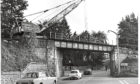 1970: With the approach of winter weather the contractors who are lifting the former Deeside railway line, W. H. Arnott, Young and Co. Ltd., groups and making an earlier start on removing the bridges along the line than was anticipated.
