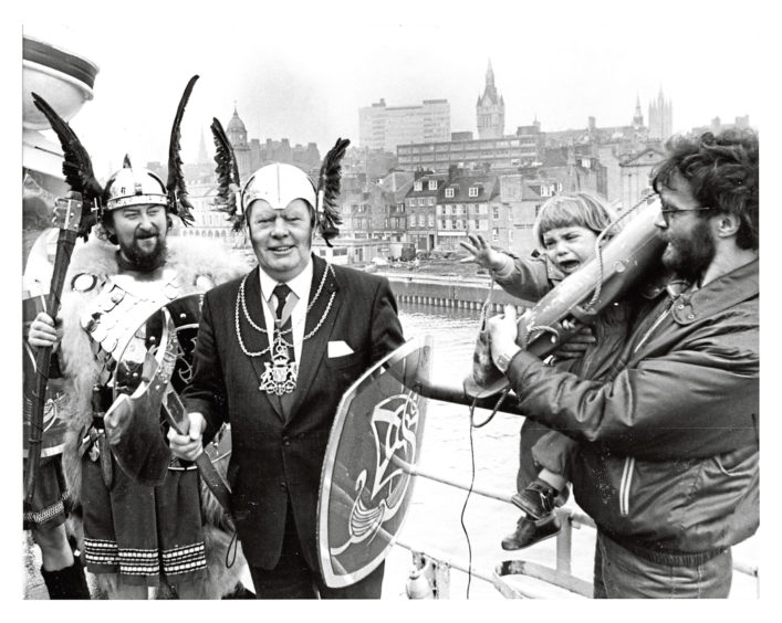 1986: Two-year-old Niall McKenzie, 29 Claremont Grove, Aberdeen, didn't think much of Lord Provost Henry Rae's latest headgear - In fact he was terrified! The Lord Provost took the opportunity of trying out the Viking "hardware" when he met Jarl Gordon Strachan (left) on board the ferry St Clair at Aberdeen Harbour yesterday for "Shetland Comes to Town".