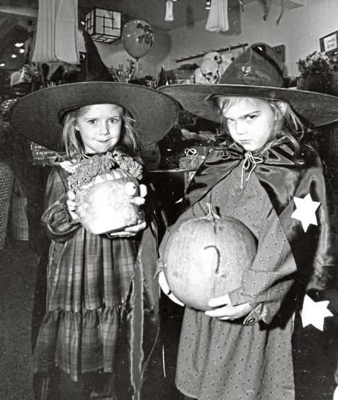 1986: Ginny Thomson (4) and Chloe Lively (4), both Bieldside, Aberdeen, get ready for the Hallowe'en frolics