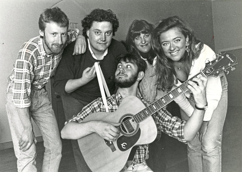 1991: James J Smith plays the guitar with other cast members (from left) Pete Cram, Kenny Luke, Nicky Lamb and Flo Meldrum, preparing for the Aurora Rabble 2 production for the Aberdeen Alternative Festival. 10 October 1991.