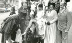1988: Lyric Musical Society hostess Mary Webster shows a leg to some of the cast outside the theatre.