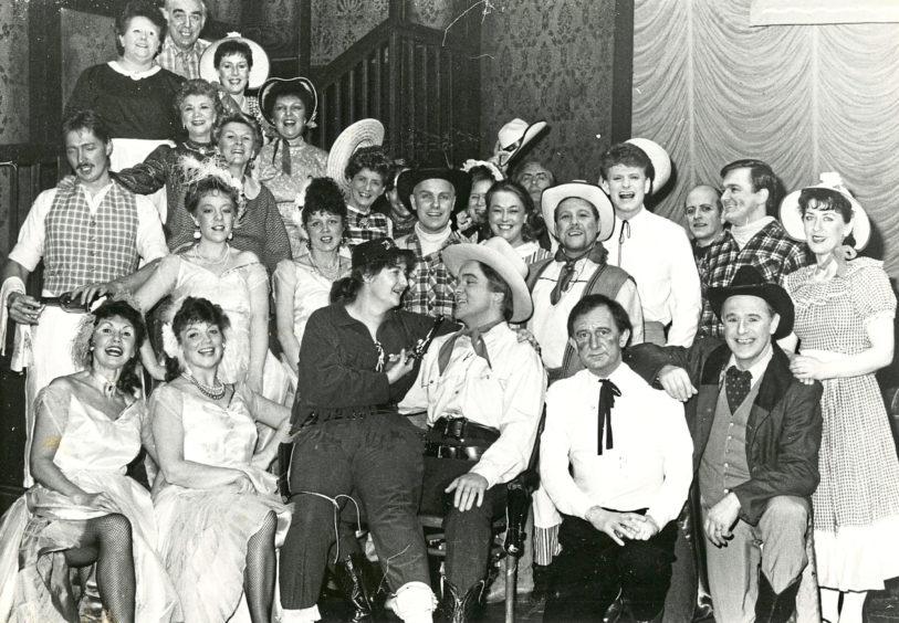 1988: A happy scene from the Lyric Musical Society's production of Calamity Jane which goes on at the Music Hall from tonight until Saturday. Anne Gordon (centre) who plays Calamity and Andrew Begg (Wild Bill Hickock) are surrounded by members of the cast.