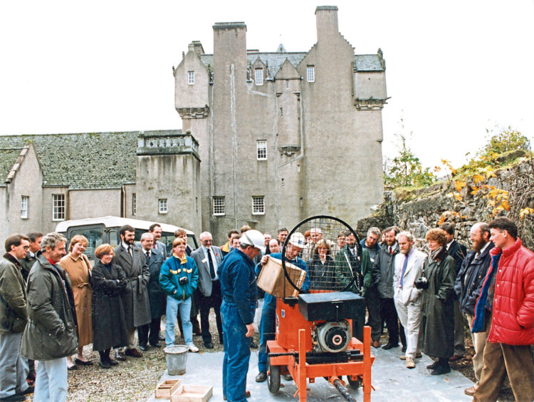 1983: Banchory woman Miss Bessie Brown (centre) is joined by Banchory Venture Scouts and National Trust officials after she had unveiled a plaque to officially open a nature trail for the disabled at Crathes Castle yesterday. The trail was mainly constructed by the Venture Scouts. Three wheelchairs for use on the trail were presented yesterday  two from the Kincardine and Deeside Members Centre of the Trust, and one from youngsters at Banchory Academy in memory of pupil Ian Thomson, Birkenbaud, Crathes, who died in a road accident on February 4.