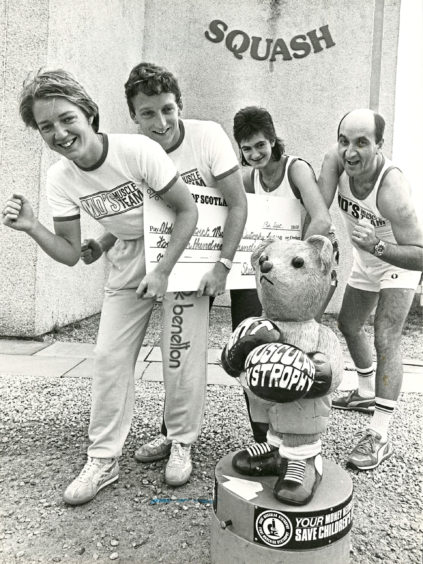 1988: Four Dyce Squash Club members have helped collect a cheque amounting to £1400 from a 10 kilometre (6 miles) Fun Run they took part in with other members earlier this year. The recipients will be the Muscular Dystrophy charity and the fund raisers left to right - Sarah Best, James Dufty, Alison Mutch and Denis Gratten.