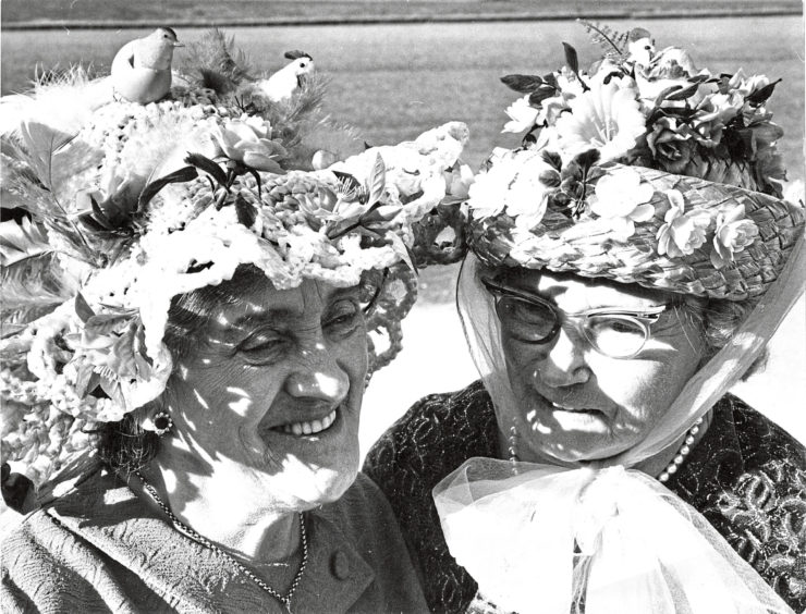1970 - In their Easter bonnets  Miss J. Angus (left) and Mrs C. Sheret at a showing held by St Clements OAP Club in the dining hut, Hanover Street School.