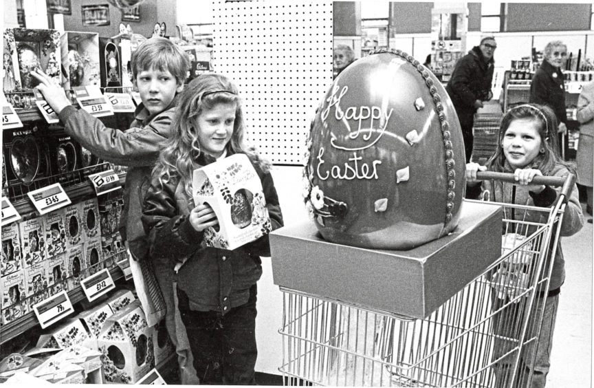 1984 - Thats eggsactly what I want for Easter says seven-year-old Angie Beaton.
But Angie (right), brother Lee (10) and sister Melanie (8) of 24 Corthan Drive, Aberdeen, had to make do with something a little smaller.
The giant 25lb egg is one of 250 from Rowntree Mackintosh in Woolworths stores all over Britain which will be given to charity.
But Woolies, Aberdeen, assistant manager Myles Laing has asked Evening Express readers to suggest who they think would most like the monster in Aberdeen.
Wed like to hear suggestions and their reason and we will pick the best, said Myles.
