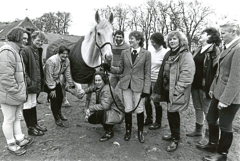 1989: Checking this horse's leg during a visit to Hayfield Riding School, near Aberdeen, by members of the Huntly YTS (Equestrian) venture are training co-ordinator Mrs Ailsa McIntosh (third left) and scheme manager Mrs Jane Pidcock. The scheme has 35 participants who gain experience in a variety of stables in the North-east for work in the horse related industry