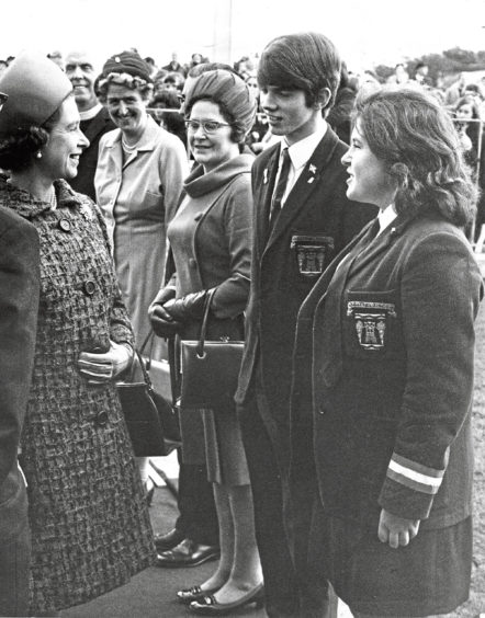 1970: The Queen speaks to senior prefects Derek Archibald and Edna Christie at Hazlehead Academy today at the schools official opening.