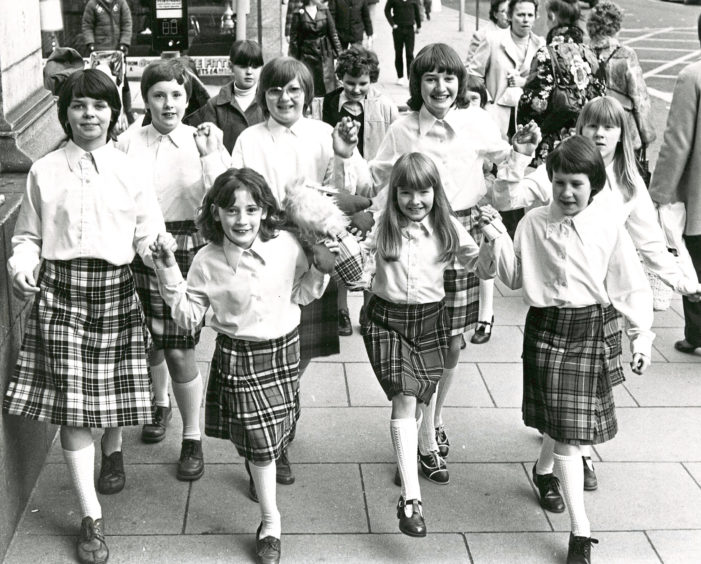 1989: These young dancers from the Pam Dignan School of Dancing bring a breath of Scotland to staff at the Texaco building in the Aberdeens Huntly Street yesterday.