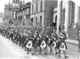 1949: The Gordon Highlanders TA marching down Union Street, Aberdeen, with their colours in 1949.'